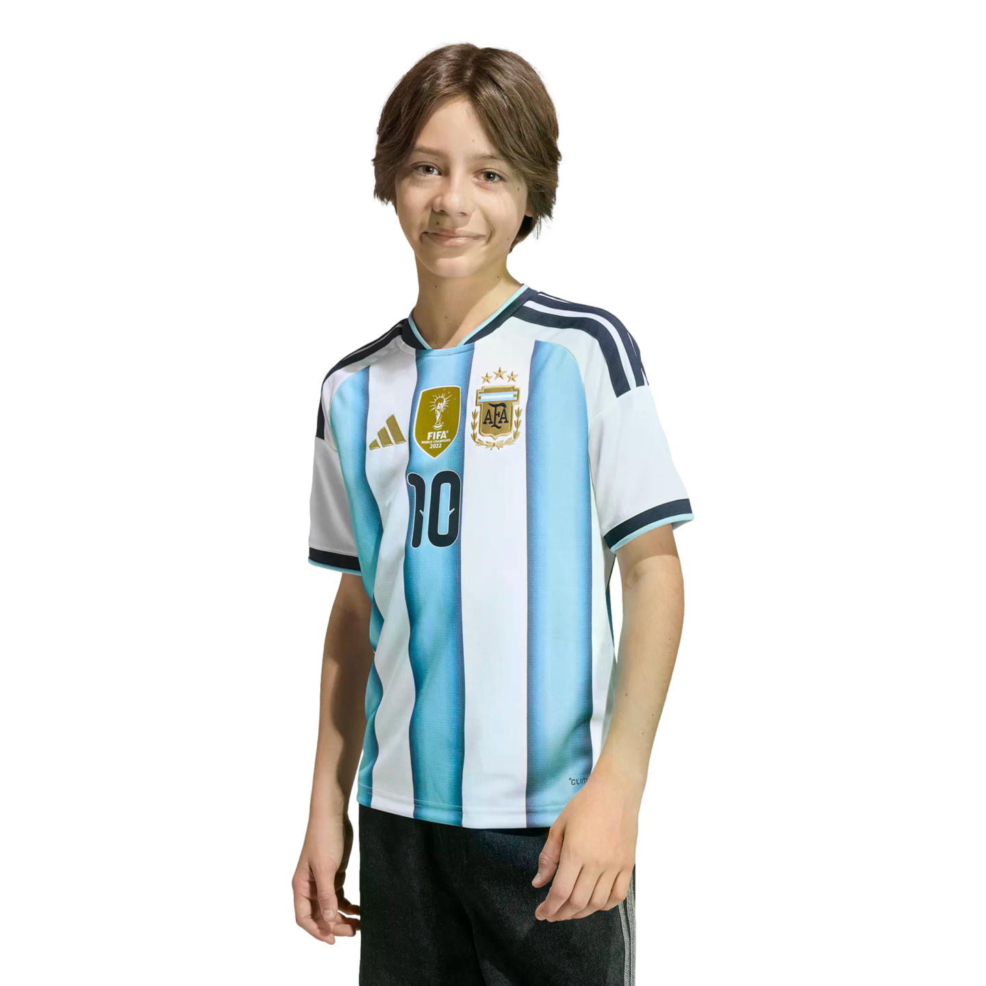 A young person with brown hair smiling in an Argentina national football team jersey with the number 10 and three stars, against a solid black background.