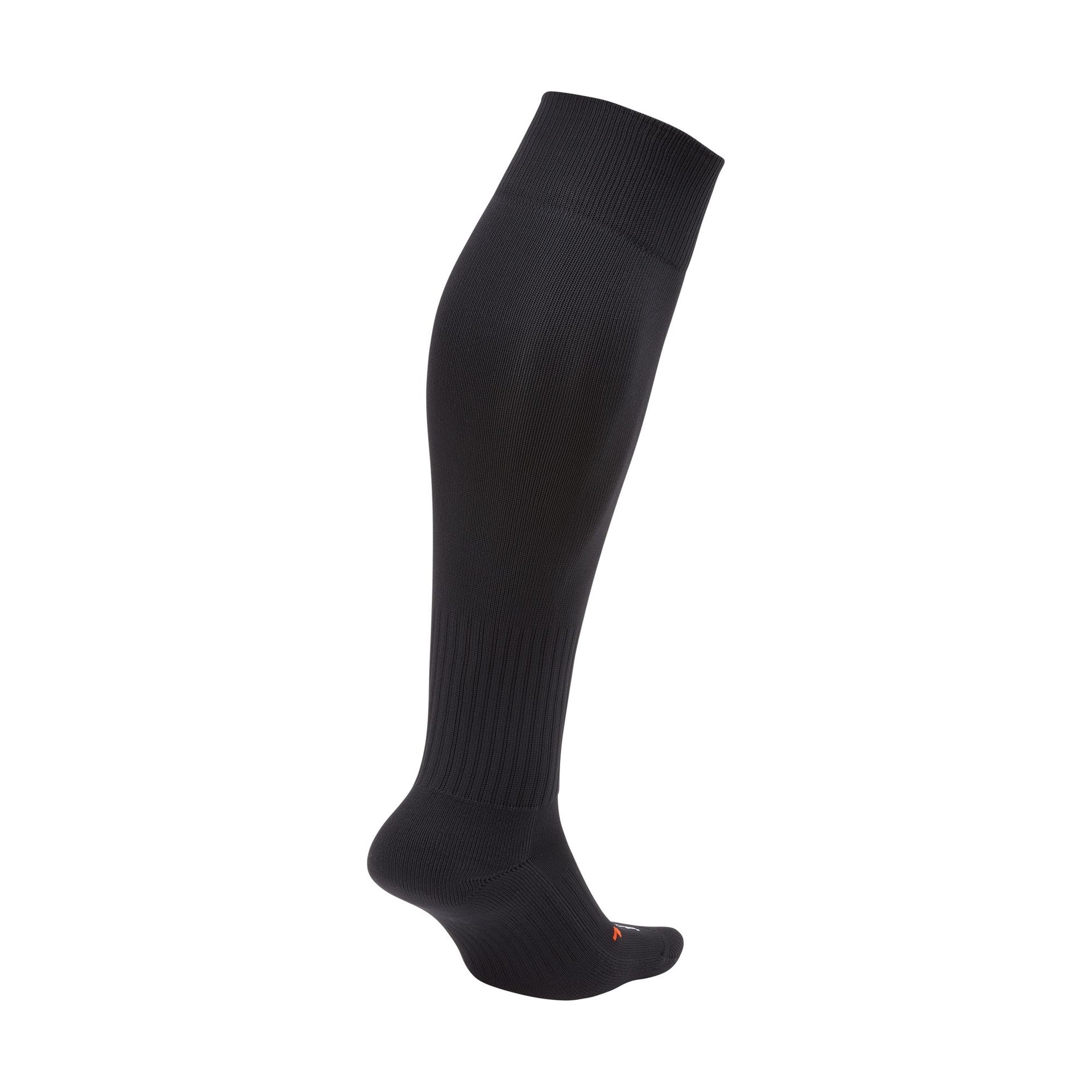 Side-view of a single black knee-high athletic sock with a ribbed cuff and a small orange logo near the toe.