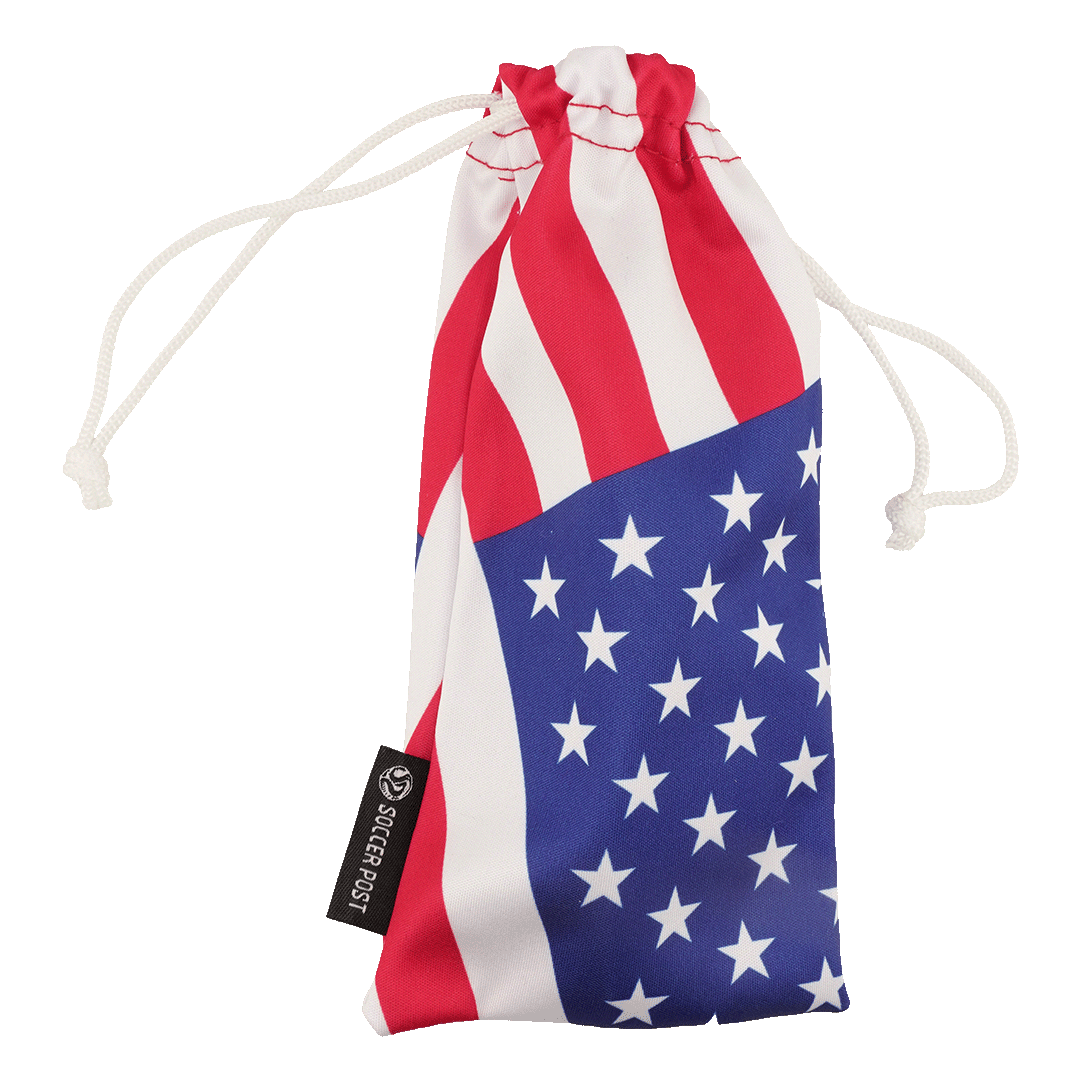 A drawstring pouch featuring a US flag design with red and white stripes on top and white stars on a blue background at the bottom. The pouch has white drawstrings and a black tag on the side that reads "SOCCER POST."